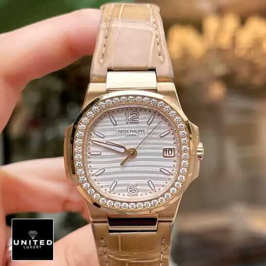 Patek Philippe Nautilus 7010R-011 "Silver Dial" High Fidelity Replica patek 7010r 011 replica 3 Patek Philippe Nautilus Leather Bracelet Diamond Bezel Replica on the hand