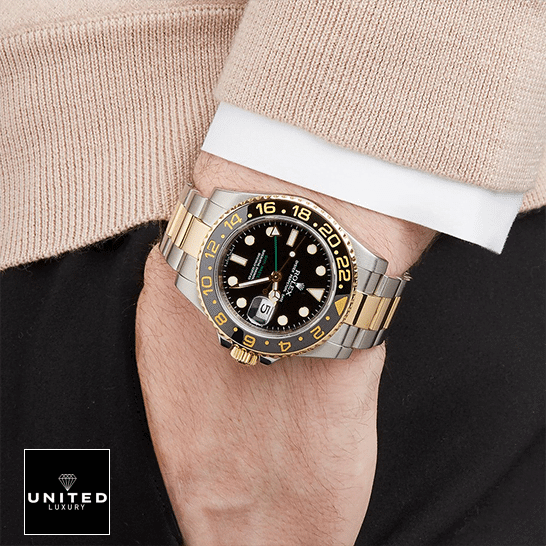 Rolex GMT-Master II 126711CHNR "Root Beer" Premium Duplicate rolex gmt master II 116713 two tone black dial oyster man hand Rolex GMT-Master II 116713 Two Tone Oyster Replica on his arm
