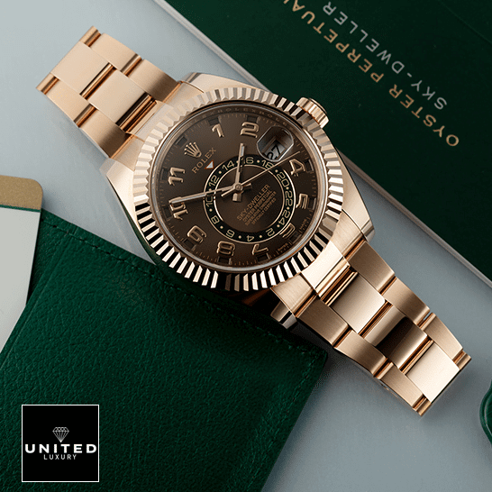 Rolex Sky-Dweller Chocolate Dial Rose Gold 326935-0003 Oyster Replica on the table