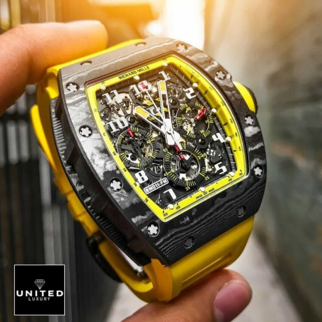 Richard Mille RM 11-03 "Yellow Storm" Detailed Super Clone Yeni Proje 3 17 Richard Mille Black Bezel Yellow Bracelet Replica on the hand
